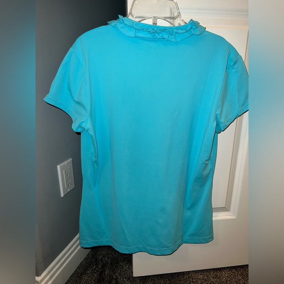 UPF 50 Luxletic Frida Ruffle Polo
Top in blue horizon Medium only worn once - Picture 3 of 3